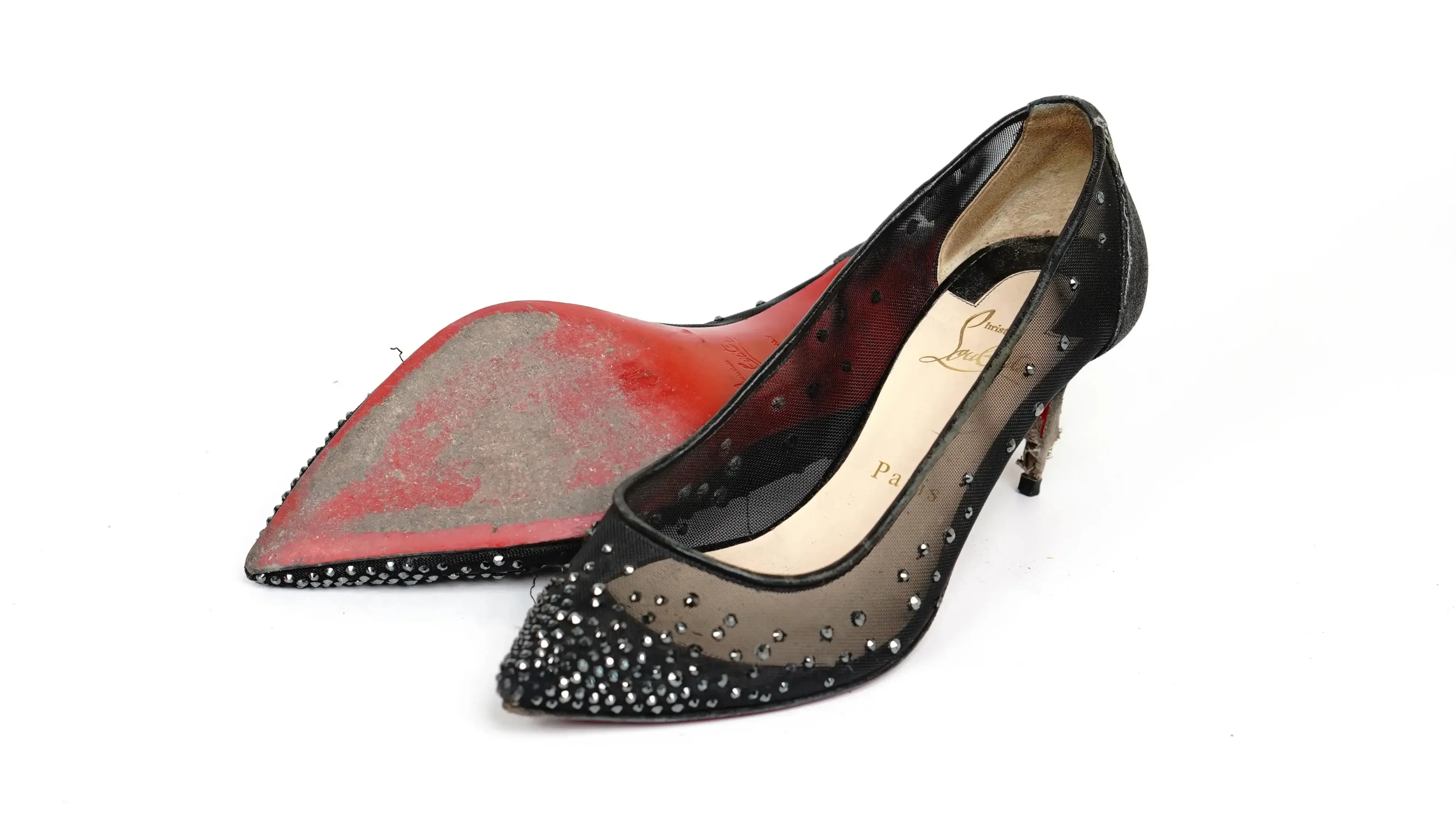 After Christian Louboutin sole repair restored glossy red finish