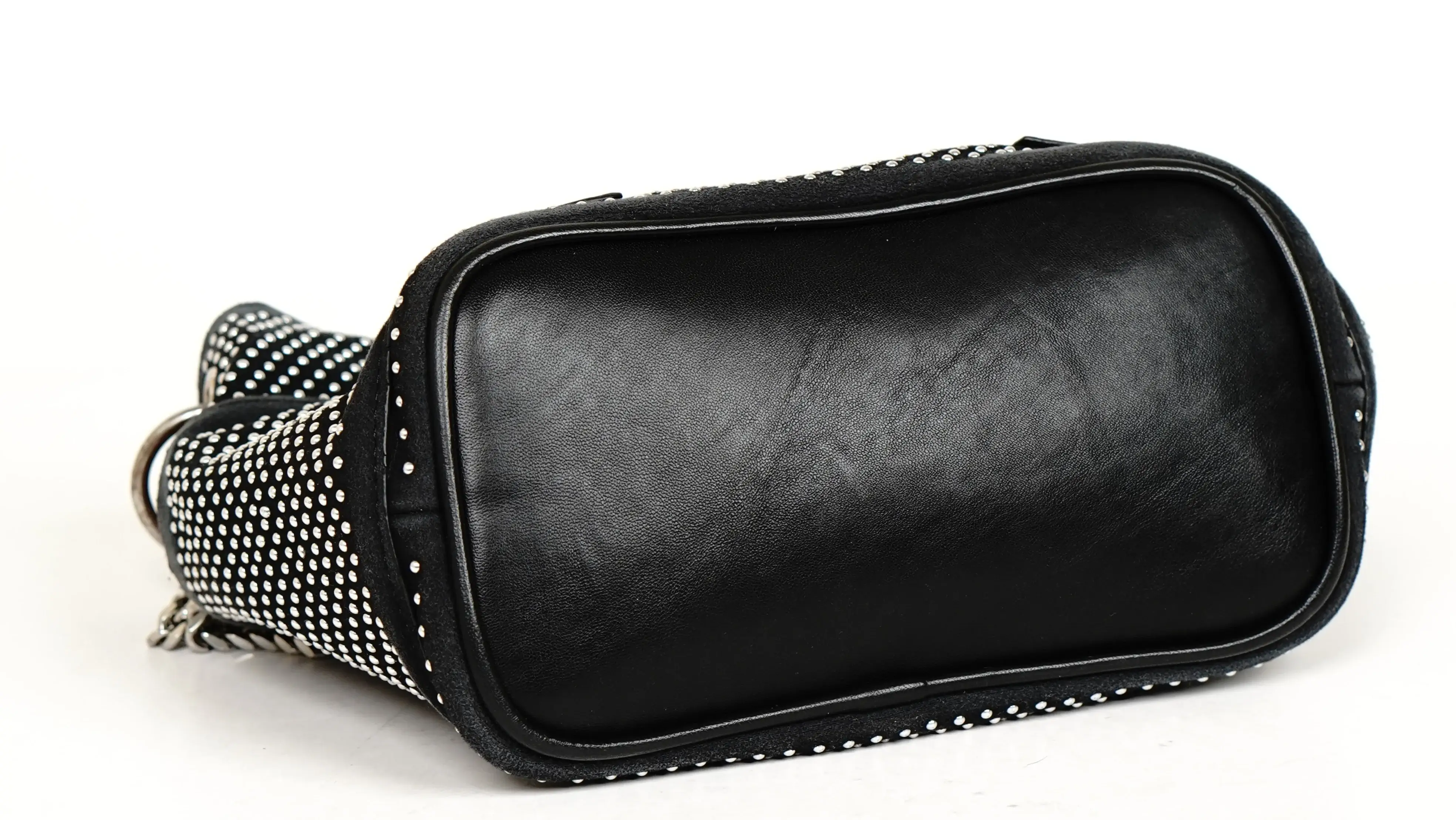 Before Jimmy Choo handbag restoration cracked PU panel with surface deterioration