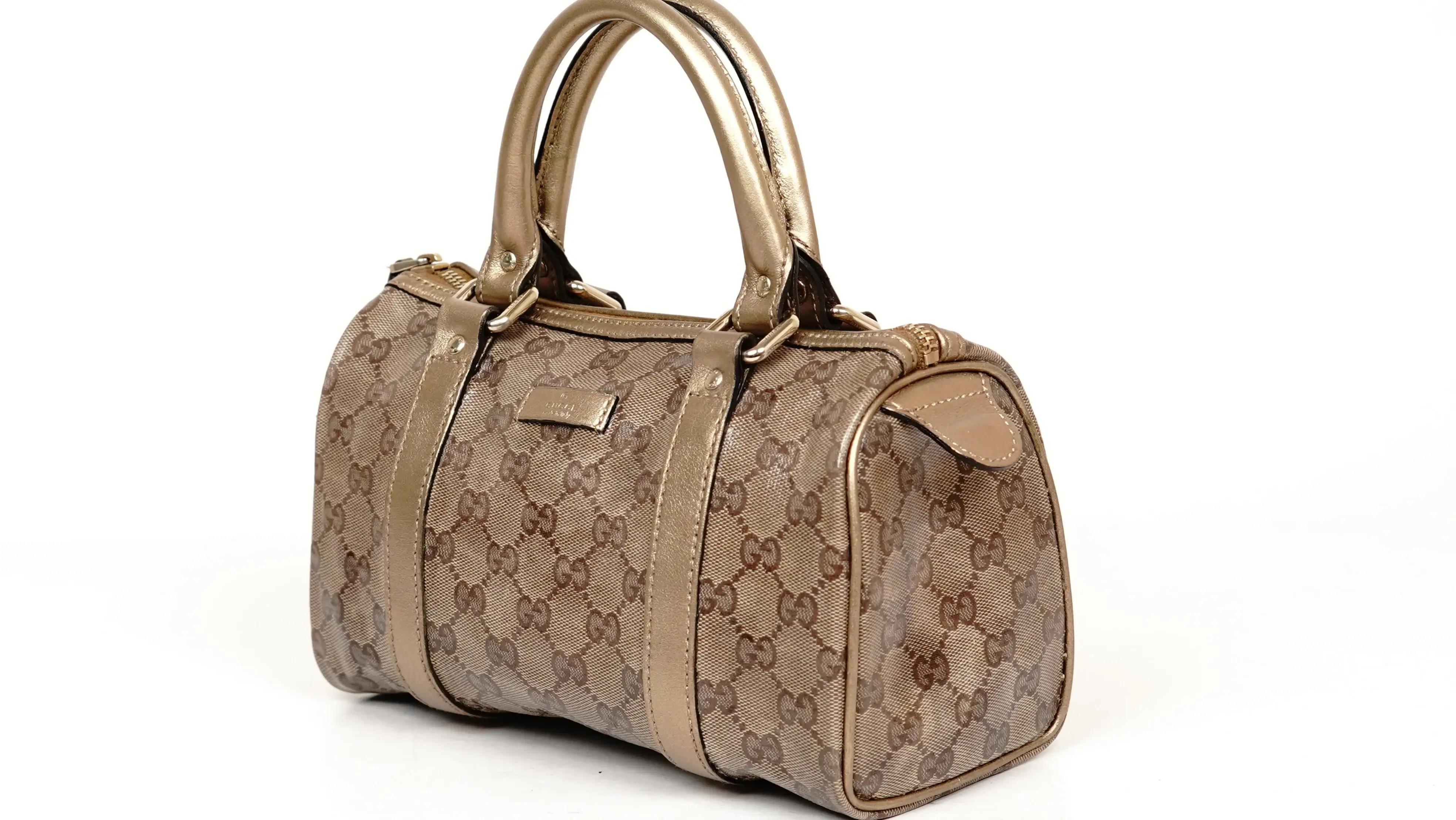 Before Gucci handbag restoration damaged leather shell with visible wear and cracks