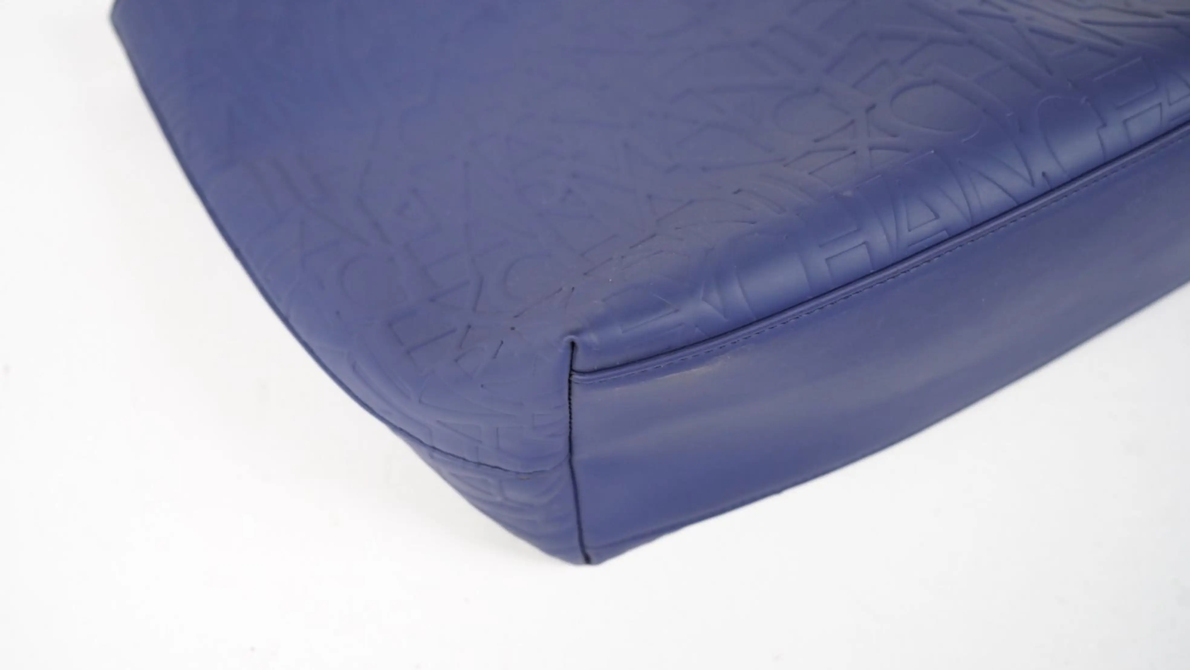 Before Armani Exchange bag restoration torn base edges and surface abrasion from prolonged use